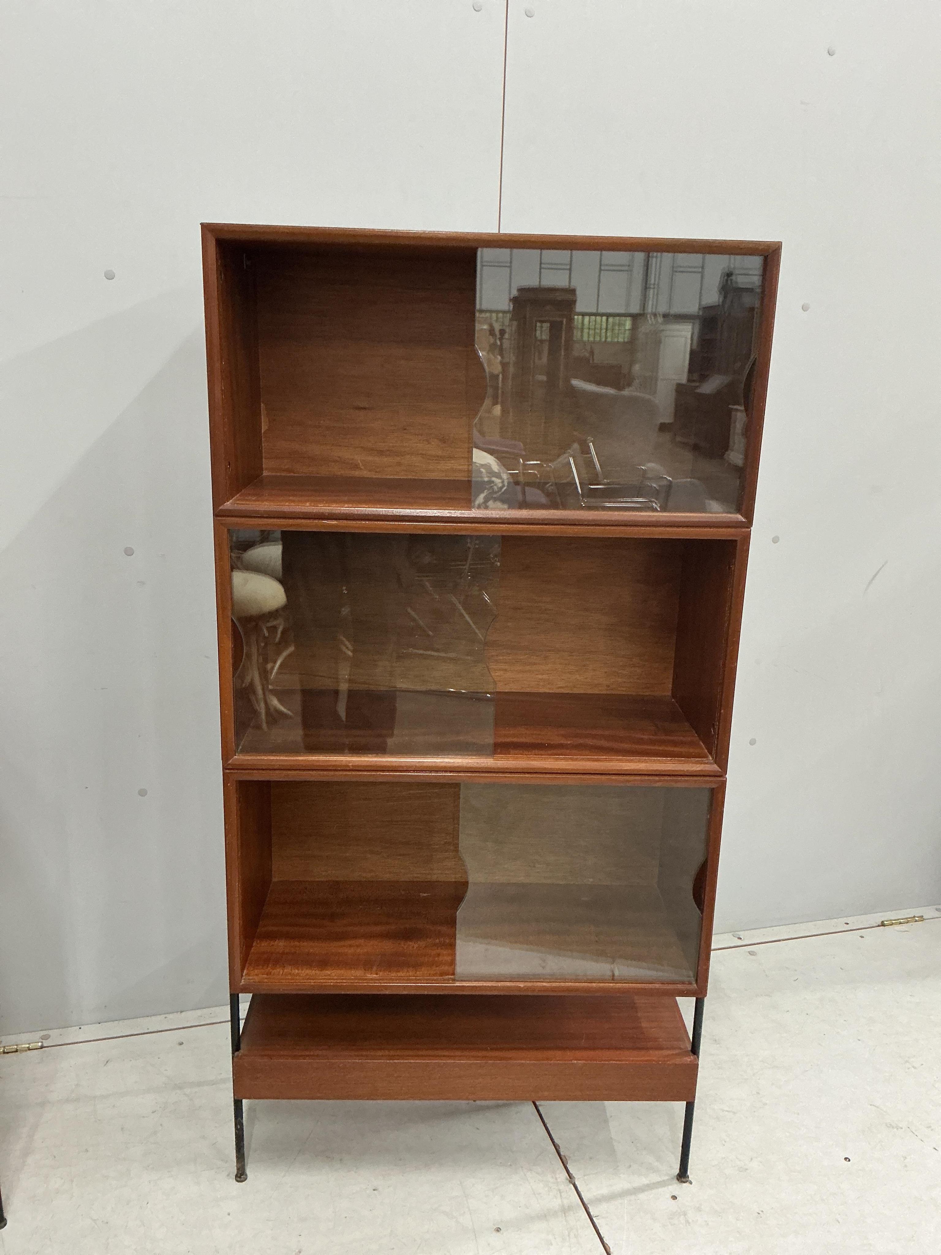 A mid century bookcase, width 70cm, depth 30cm, height 138cm together with a small cupboard